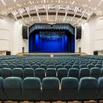 interior-of-a-white-conference-concert-hall-or-theatre-with-blue-scene-and-green-seats.jpg